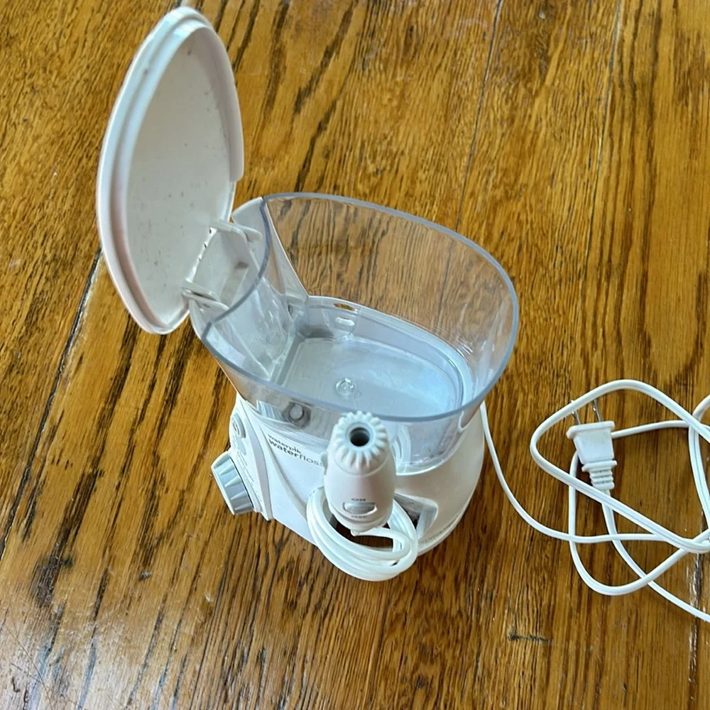Waterpik brand water flosser. Used but great condition. No personal attachments